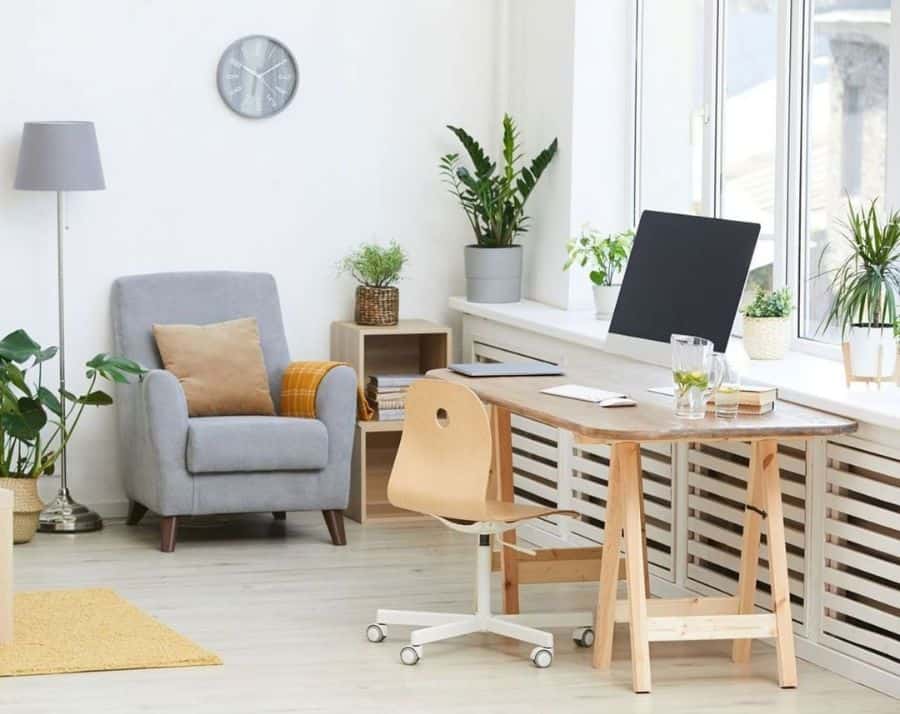 calm home office with gray accent chair and plants