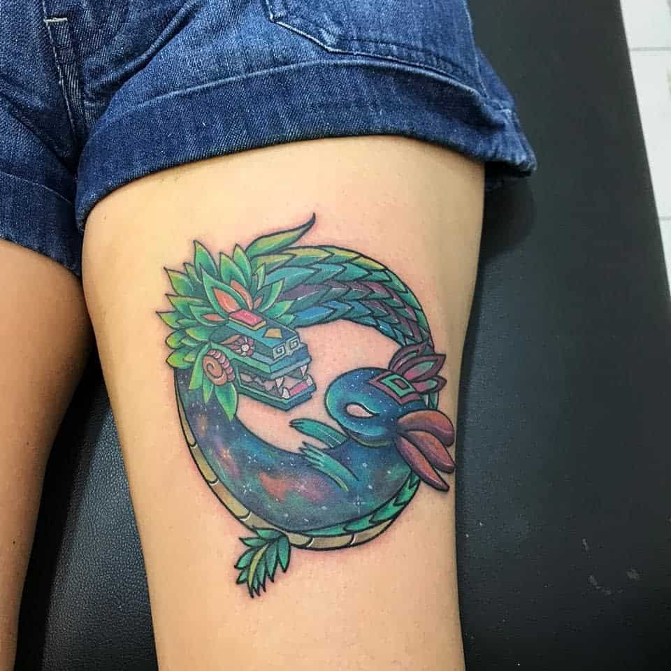 Colorful Ouroboros Quetzalcoatl tattoo with vibrant feathers and cosmic background, symbolizing rebirth