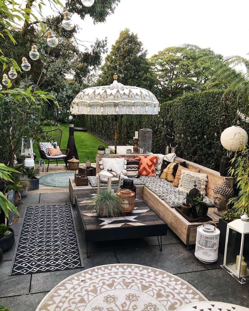 large paver patio garden with wood benches 