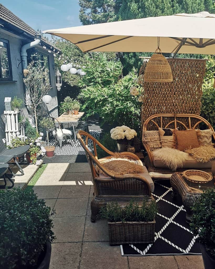 boho style backyard patio with cane furniture 