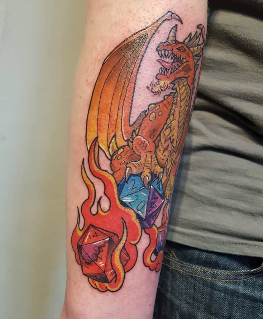 Tattoo of a dragon with dice and flames elegantly wrapped around the outer forearm