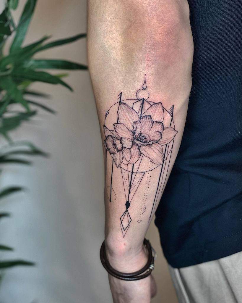 Outer forearm tattoo featuring geometric linework and delicate flowers, symbolizing balance and natural beauty