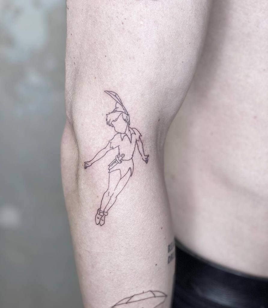 Delicate fine-line tattoo of Peter Pan floating gracefully, with minimal facial features
