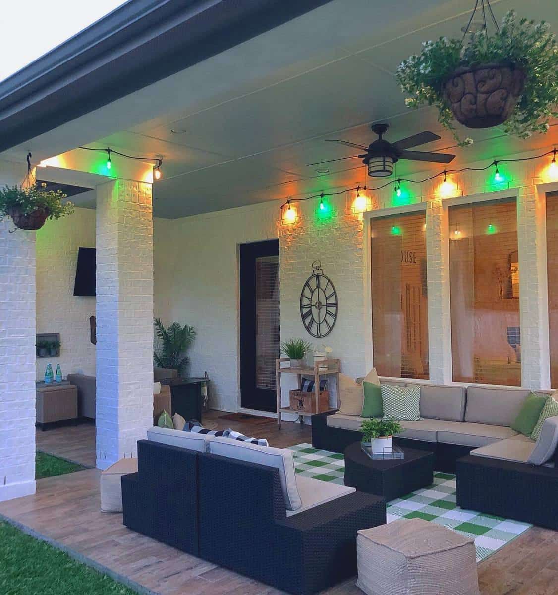 colorful string lights patio with wicker furniture