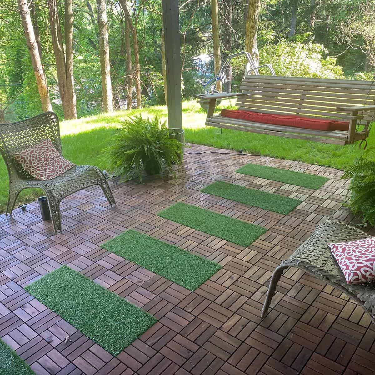 tile patio with hanging bench