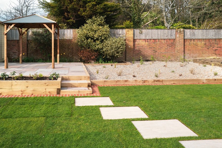 stone paver patio and green grass