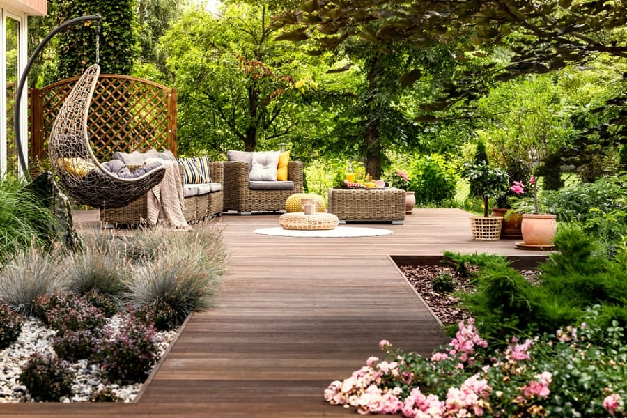 wood deck patio with wicker furniture