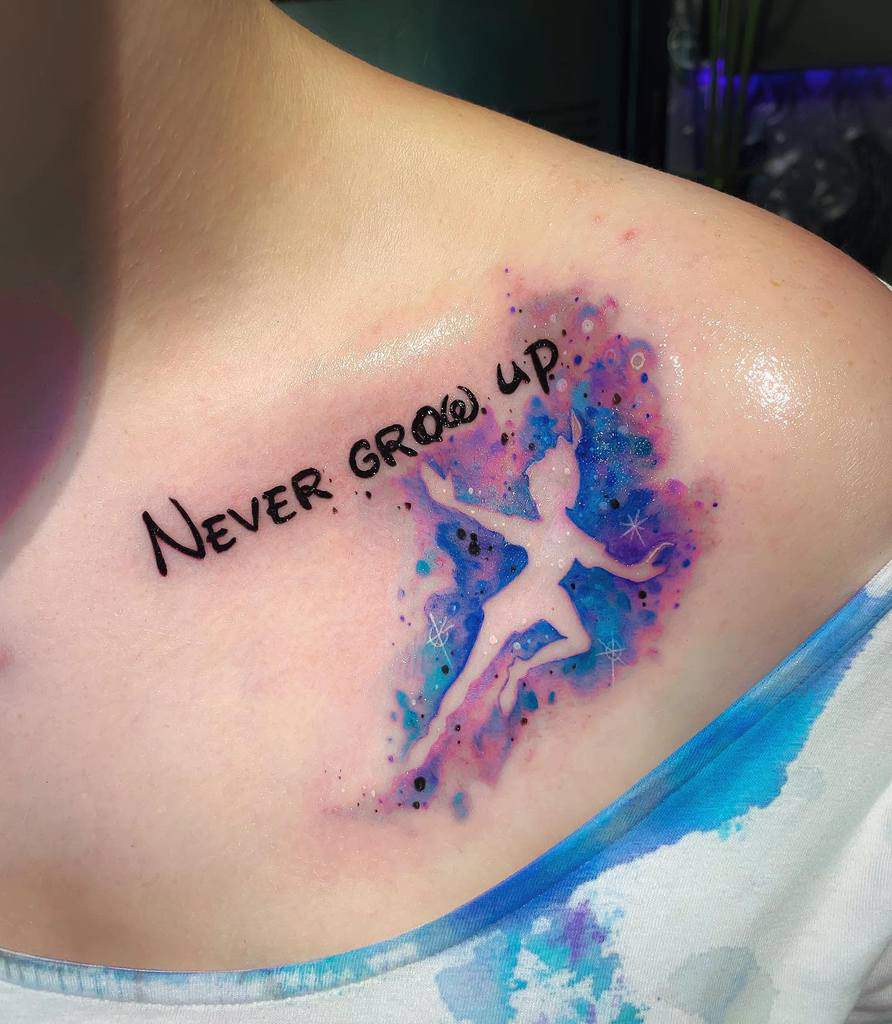 Vibrant watercolor-style Tinkerbell silhouette with "Never Grow Up" text in black ink