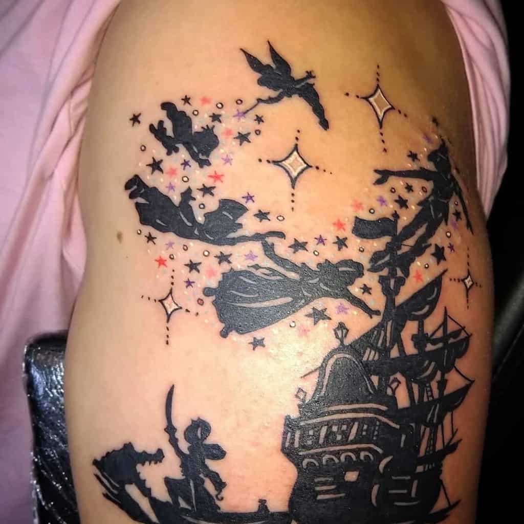 Peter Pan, Wendy, and Tinker Bell flying over Captain Hook’s ship, surrounded by stars and sparkles in a bold black tattoo design