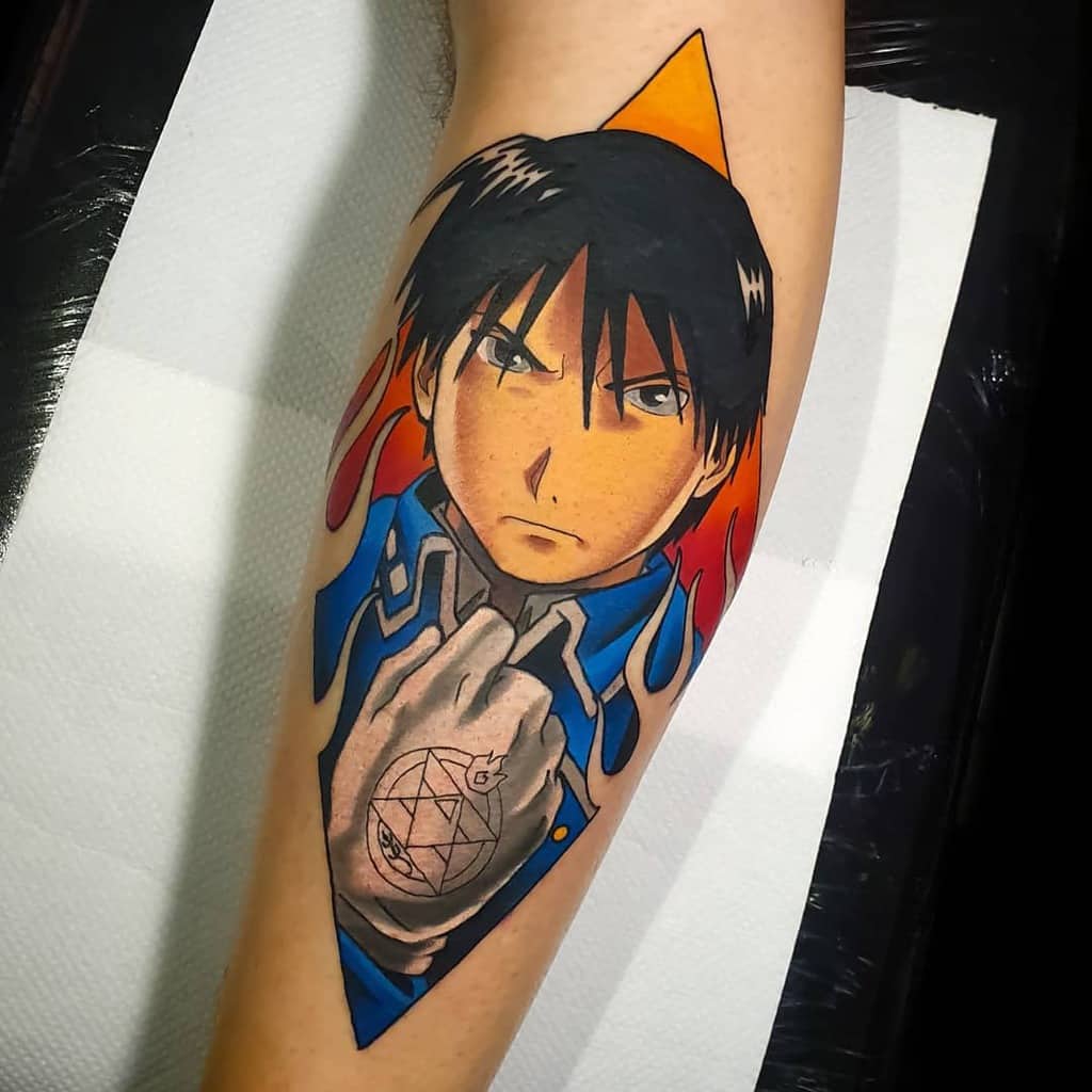 Fullmetal Alchemist tattoo of Roy Mustang with his ignition glove, intense gaze, and fiery background, designed in a bold anime style