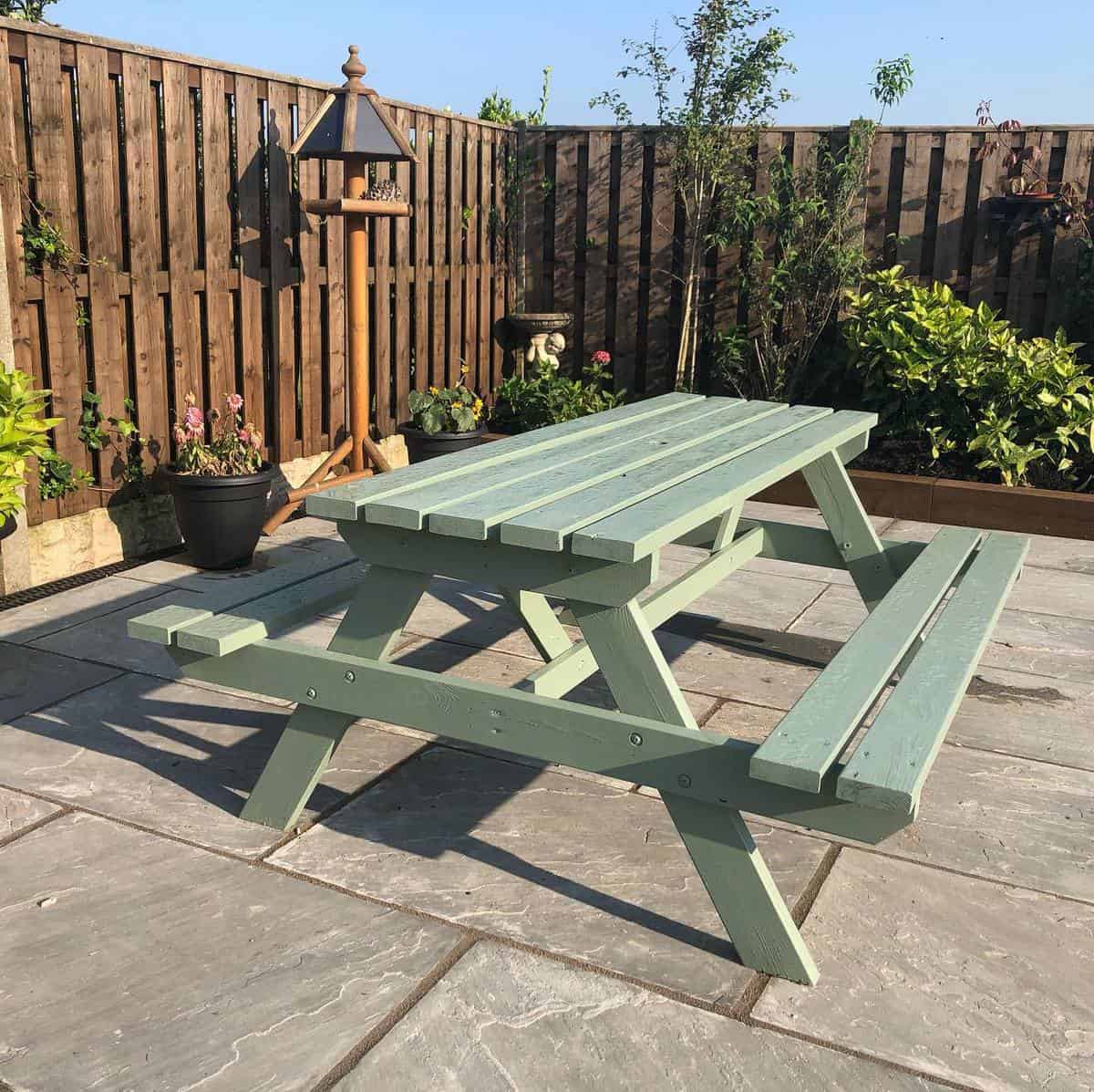 green painted wood picnic bench patio backyard