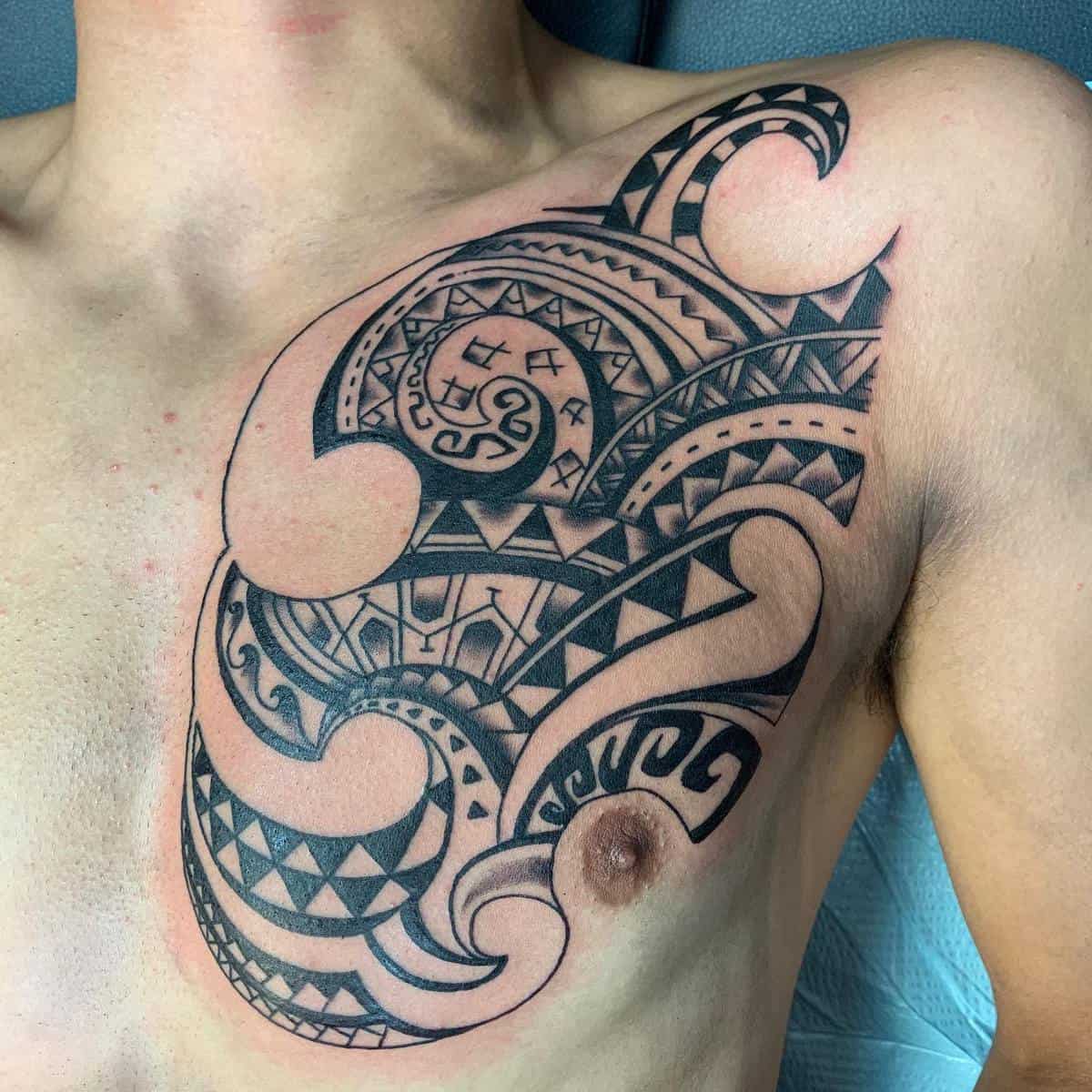 A Polynesian tribal tattoo on a chest showcases intricate geometric patterns and bold black ink, embodying the rich cultural heritage of the Polynesian islands