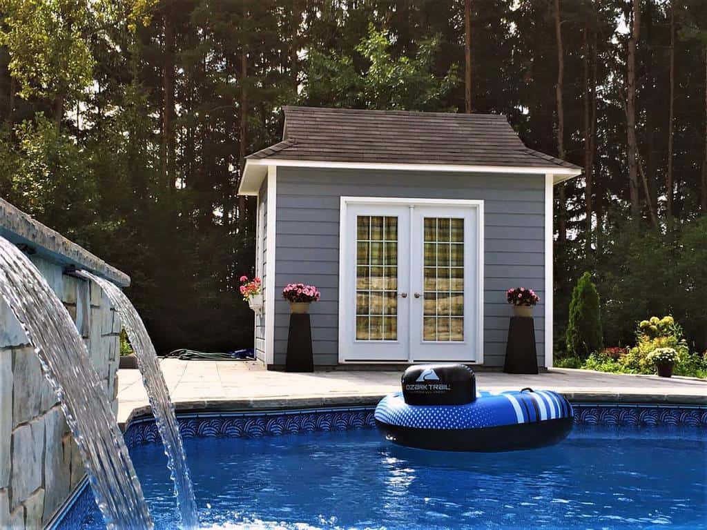 backyard pool fountain pool shed potted plants