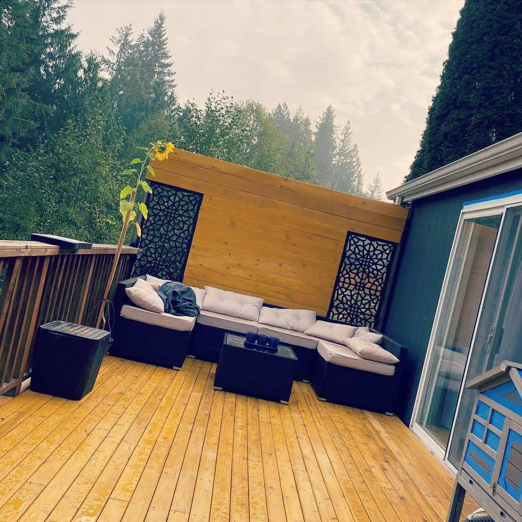 wood patio deck black sofa wood railings