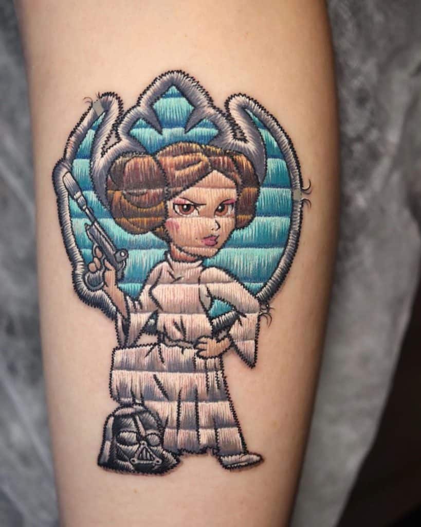 Realistic embroidered tattoo of a space princess in a white gown, with detailed stitching and a blue background design.