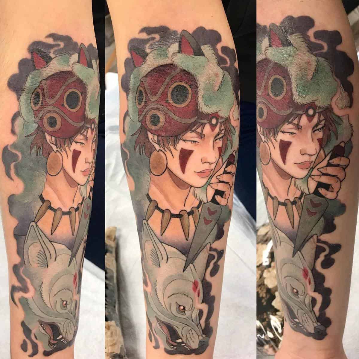 Vibrant tattoo of San with her red mask and Moro from Princess Mononoke on the forearm