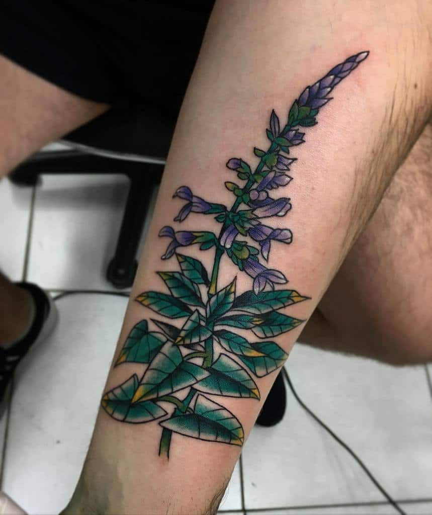 Botanical leg tattoo featuring a purple flowering plant with detailed green leaves, extending along the forearm
