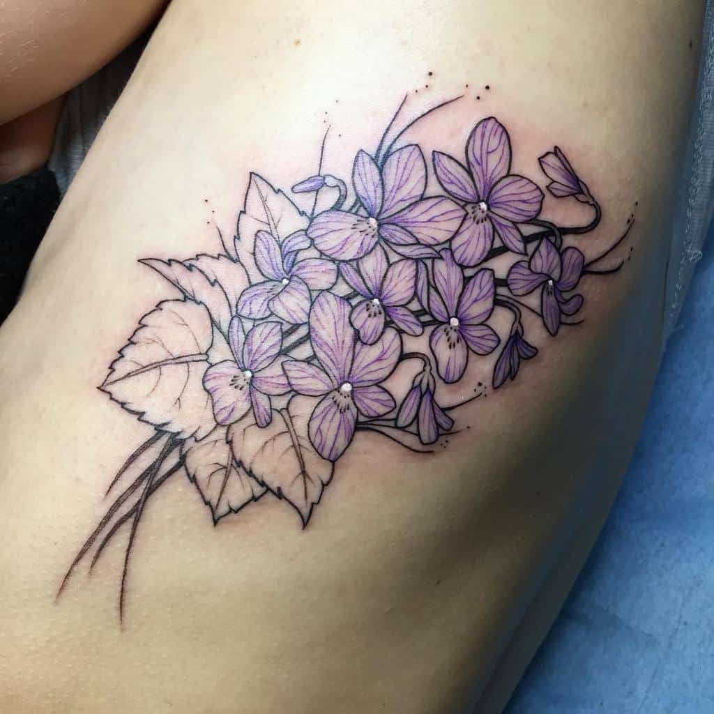 Detailed ribcage tattoo featuring a cluster of purple flowers with delicate shading and large leaves