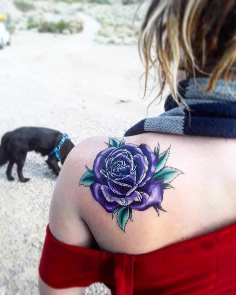 Vbrant purple rose tattoo on the shoulder