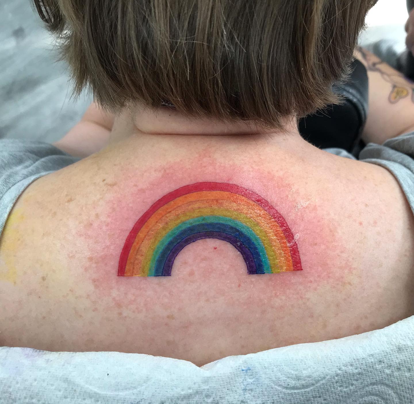 Simple rainbow tattoo on the back