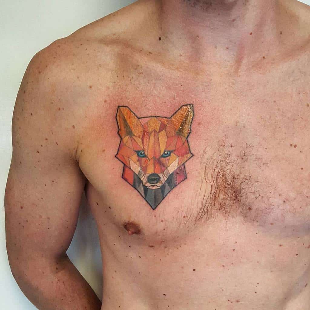 A geometric fox tattoo on a man's chest