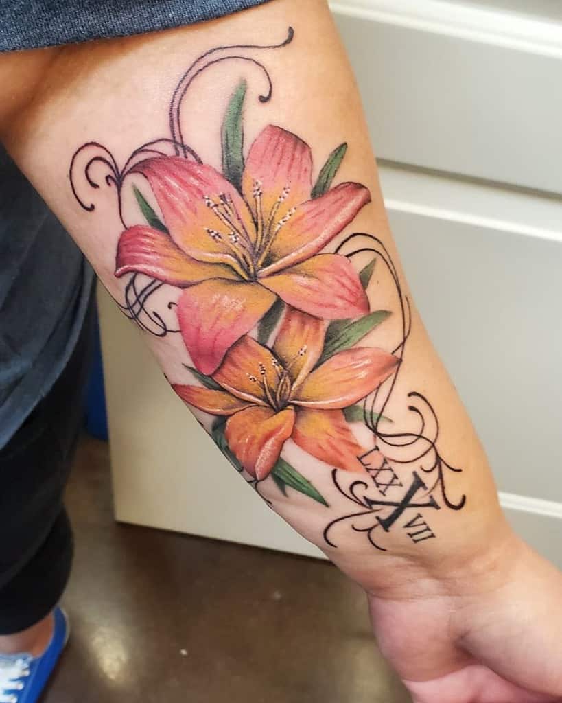 Forearm tattoo of two realistic orange lilies, a striking gladiolus, with Roman numerals and decorative swirls