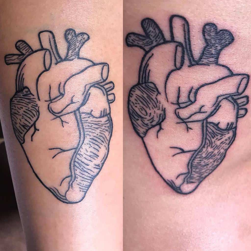 Tattoo of an anatomical heart with linework