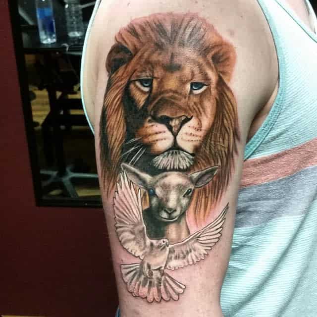Tattoo of a lion and lamb alongside a dove on a person's upper arm