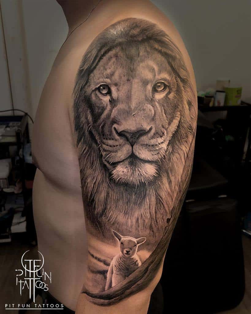 A tattoo of a lion's face and a lamb artfully intertwined on a person's upper arm