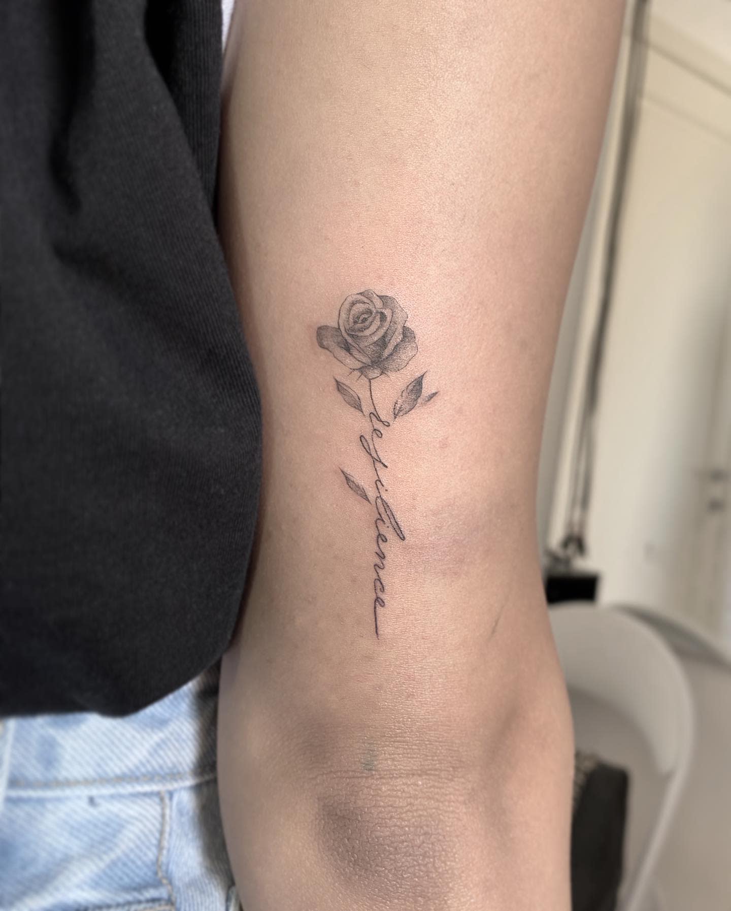 Small Resilience Tattoo with a Rose