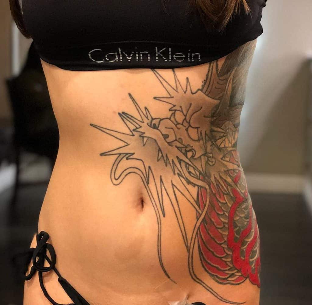 Woman's torso with a dragon tattoo