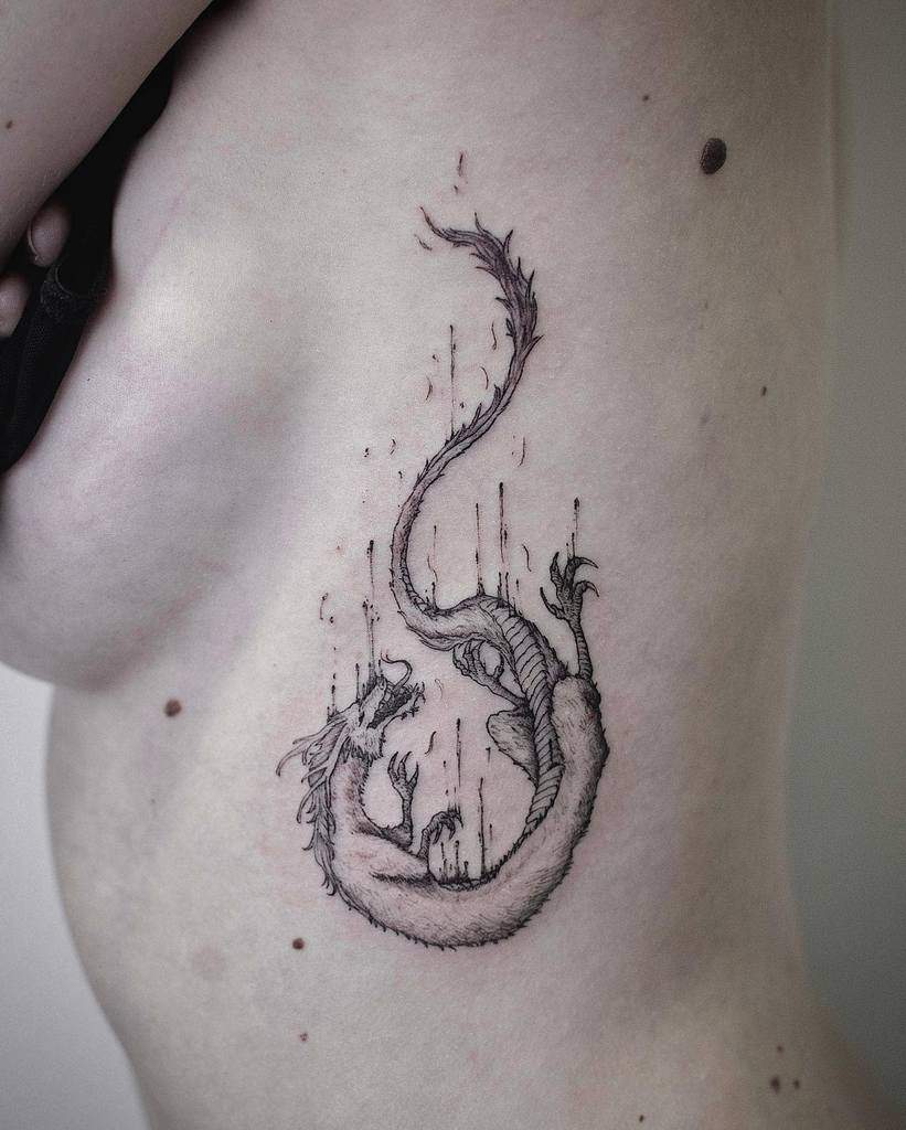 Detailed dragon tattoo featuring a long, slender body and head, surrounded by vertical line accents