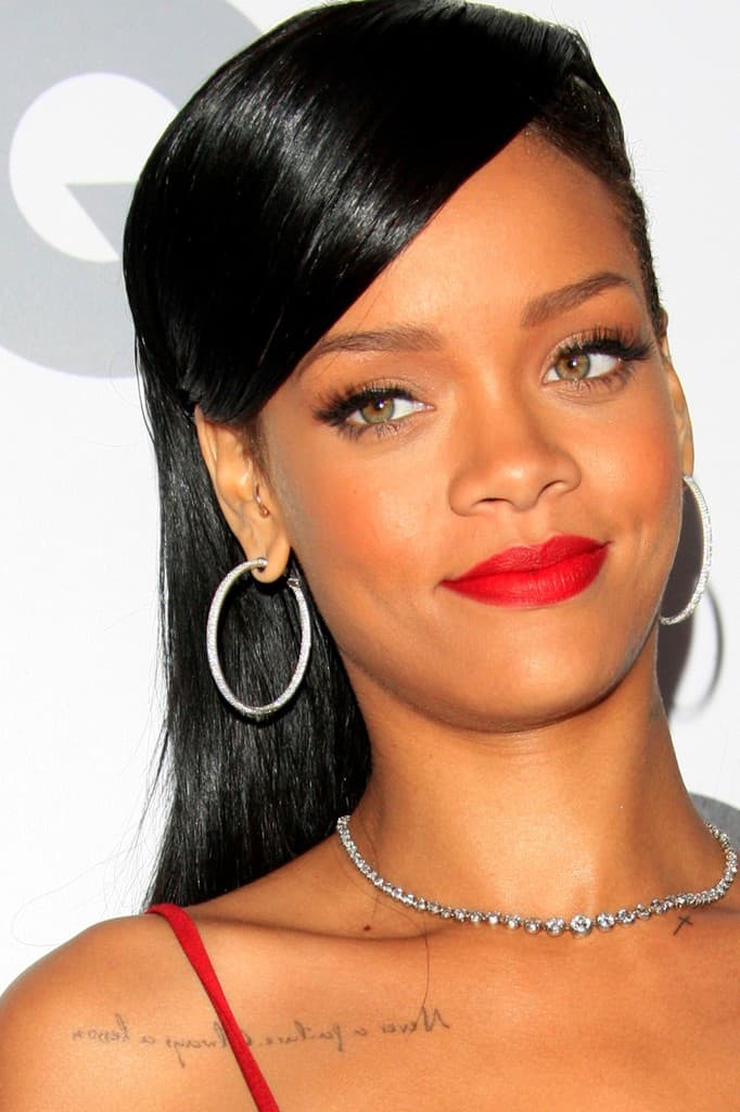 Rihanna Collarbone Tattoo Flowing Script