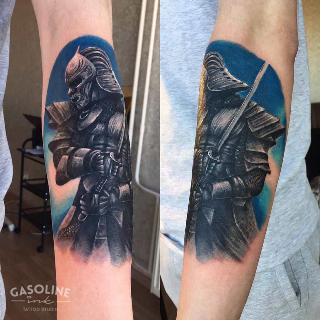 Vivid Ronin tattoo on the forearm, showcasing a samurai in full armor with a katana, highlighted by a striking blue background