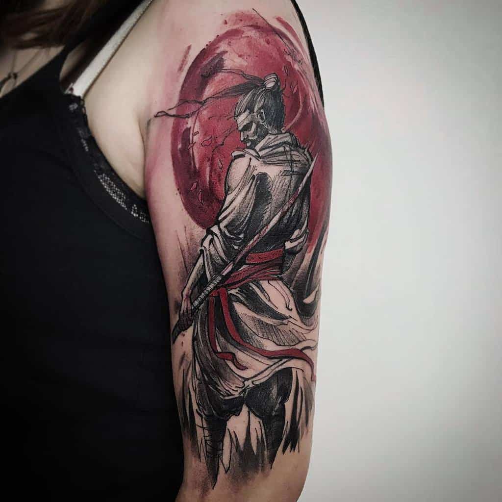 Tattoo of a samurai with a sword on upper arm, with a red sun in the background