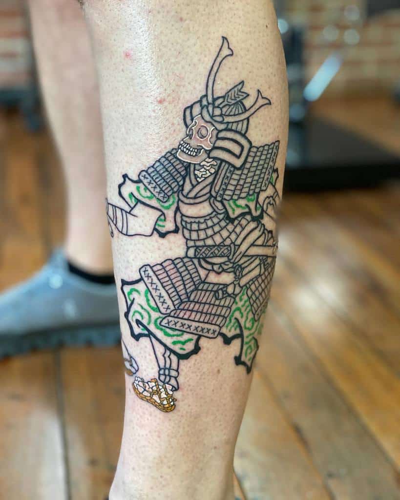 Unique leg tattoo depicting a skeletal samurai in traditional armor, accented with green and gold details