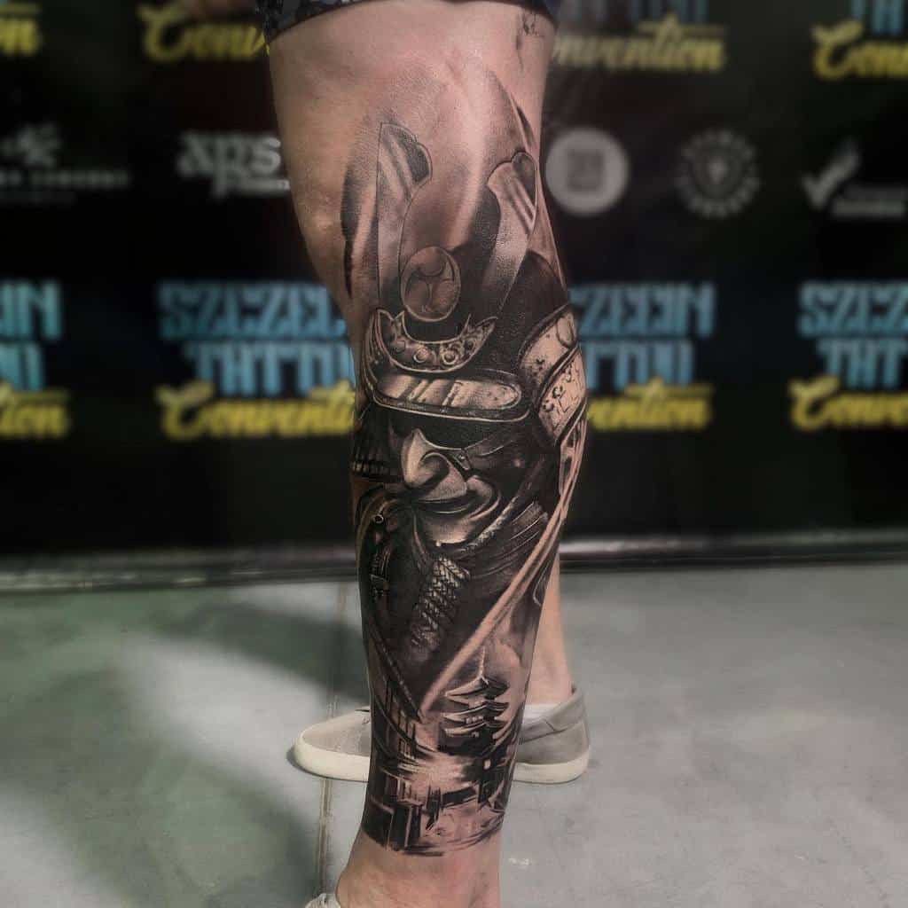 Black and grey leg tattoo depicting a detailed samurai helmet and armor, complemented by a serene Japanese pagoda in the background