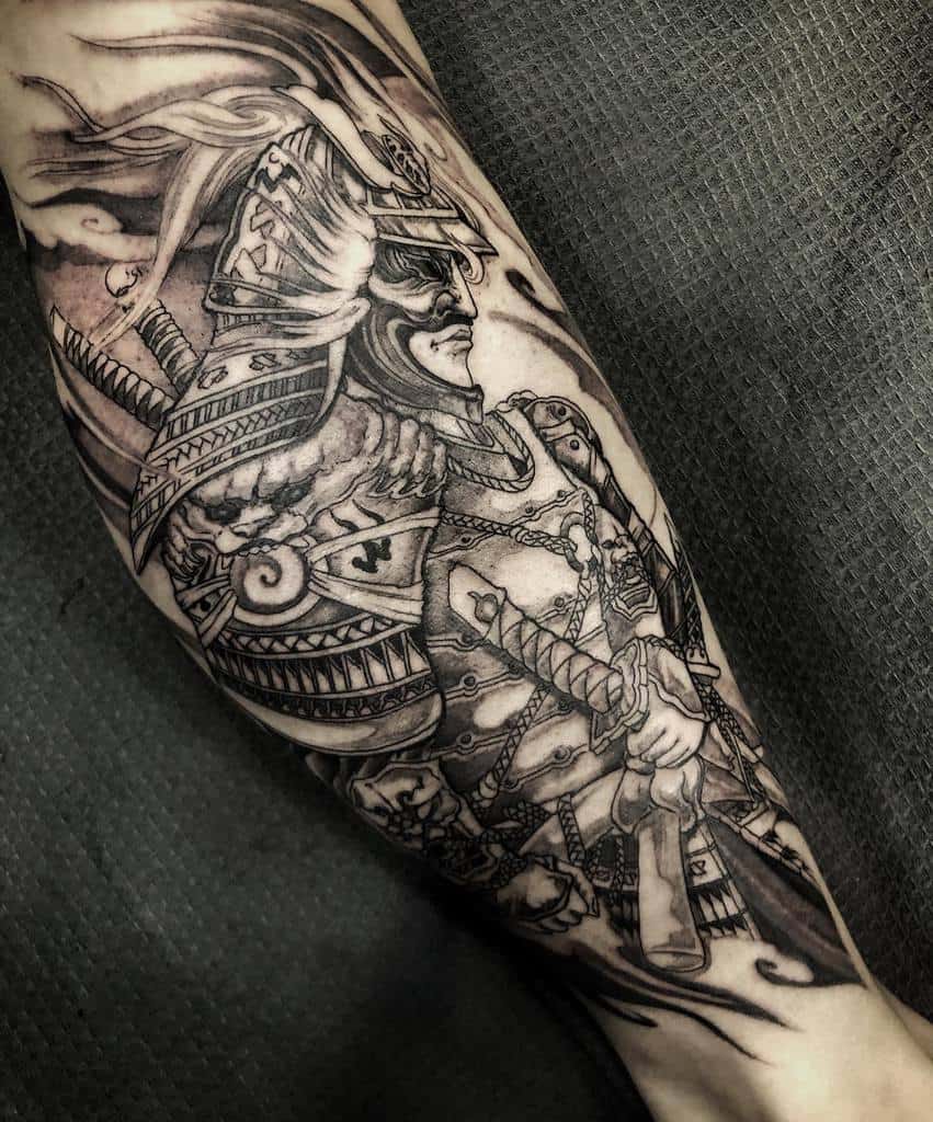 Detailed black-and-gray tattoo of a Ronin warrior in traditional armor, holding a sword, surrounded by swirling smoke accents