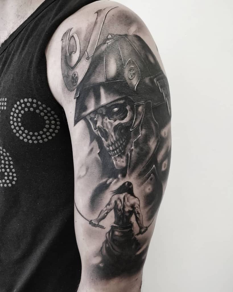 Striking black-and-gray tattoo featuring a samurai skull helmet, with a warrior holding a katana in a dramatic pose, highlighted by dynamic shading