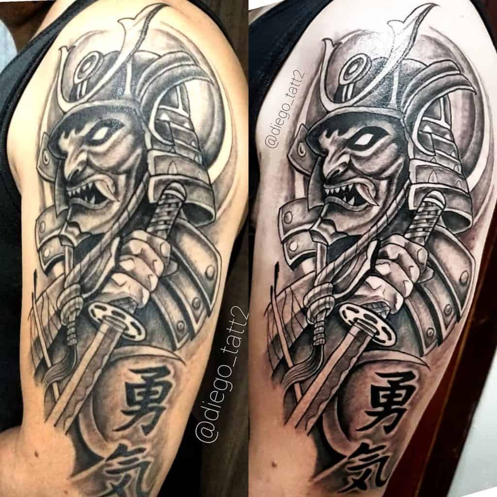 Bold black-and-gray samurai tattoo featuring a fierce warrior holding a katana, with detailed armor, intense expression, and kanji text for added depth