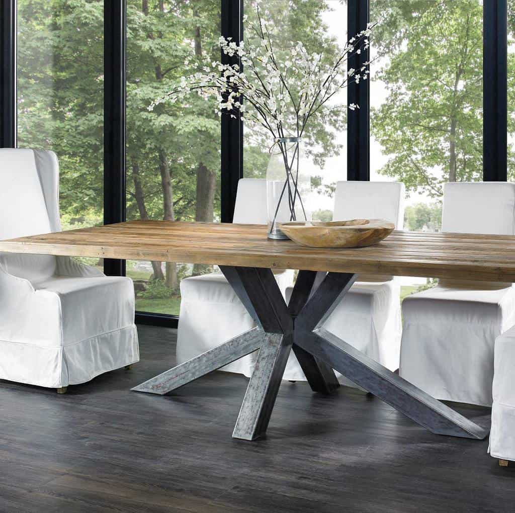 modern sunroom with wood table and white chairs