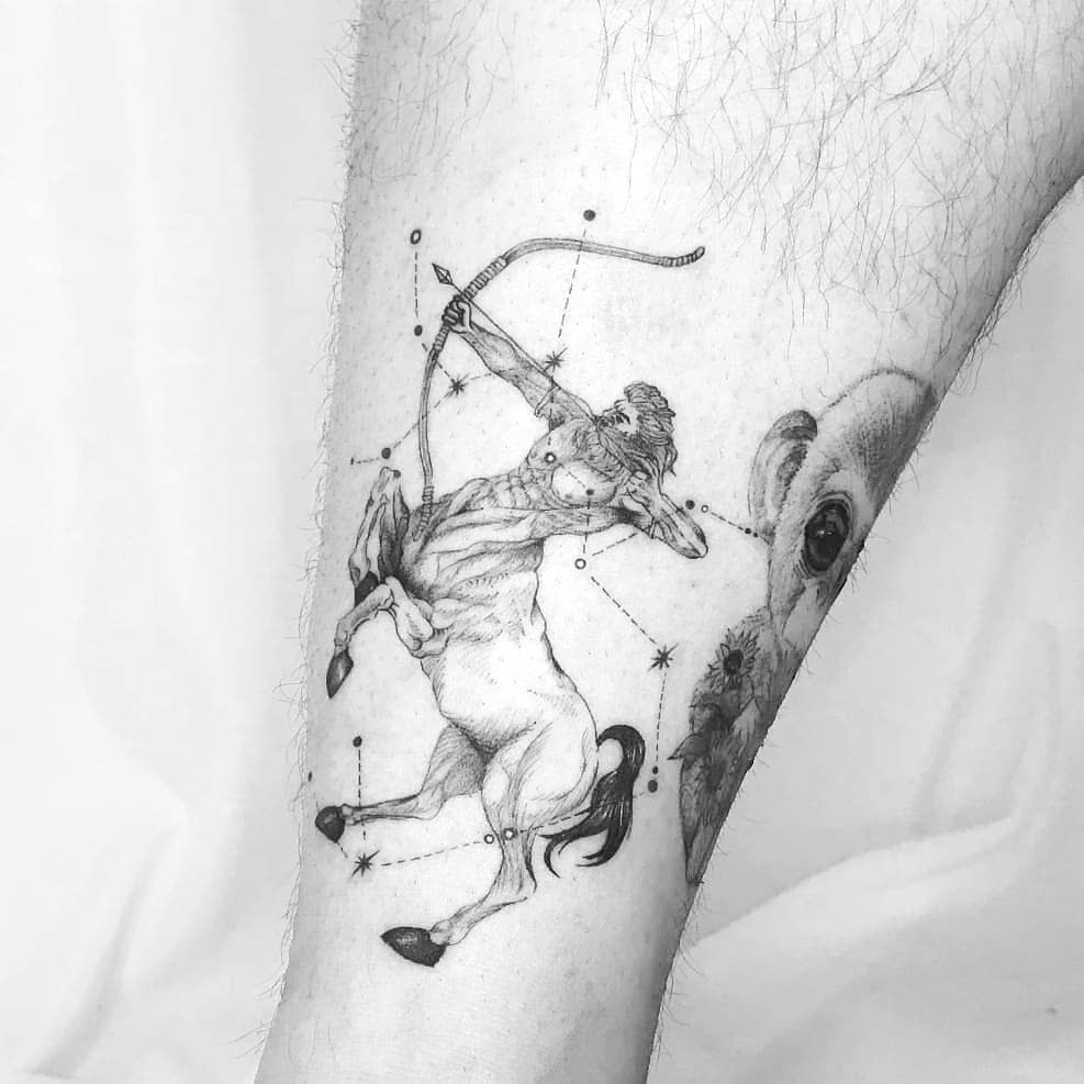 A tattoo of a centaur archer with a constellation design