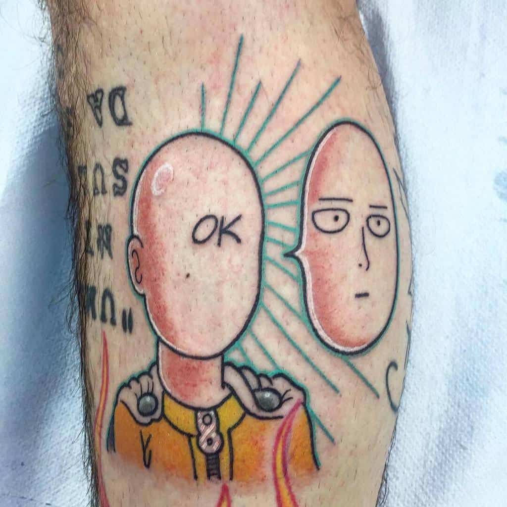 A colorful tattoo of Saitama from One Punch Man, with one face saying "OK" and another detached face with a blank expression, surrounded by radiant lines