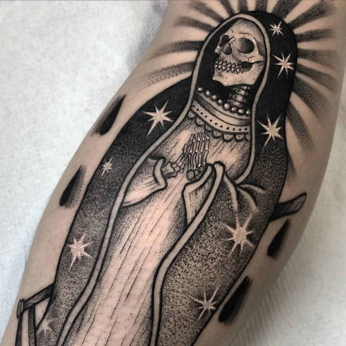 Santa Muerte tattoo featuring a skeleton with a halo of stars, symbolizing protection and spirituality