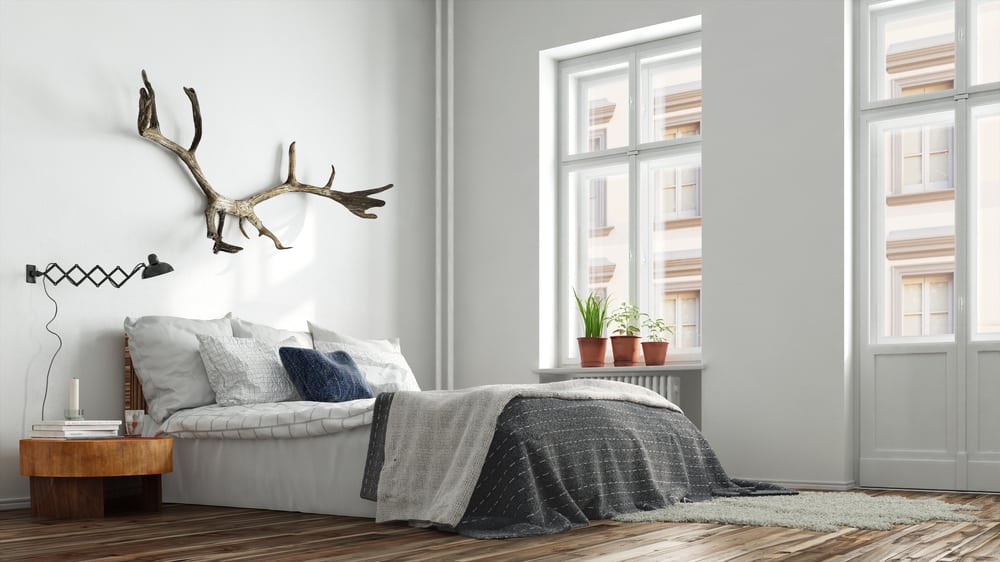 scandinavian minimalist apartment bedroom platform bed