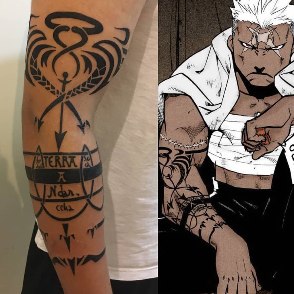 Fullmetal Alchemist tattoo of Scar’s Ishvalan alchemy markings, featuring bold black geometric patterns and text, inspired by his manga design