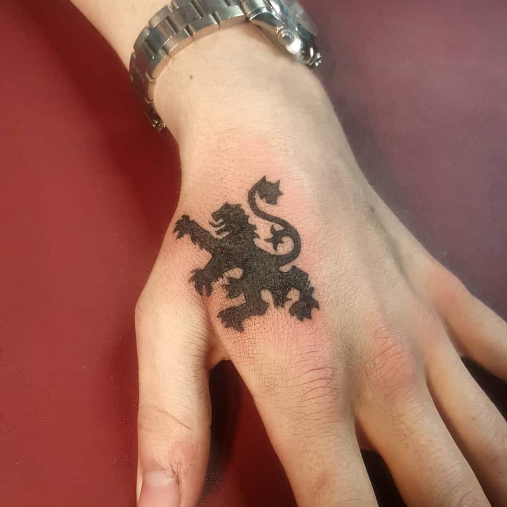 Black ink Scottish lion rampant tattoo, detailed with sharp mane and tail