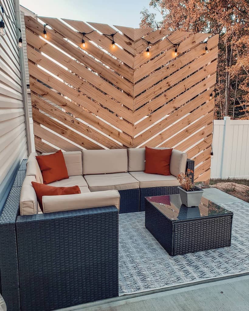 wood screen wall wicker sofa and table floor rug