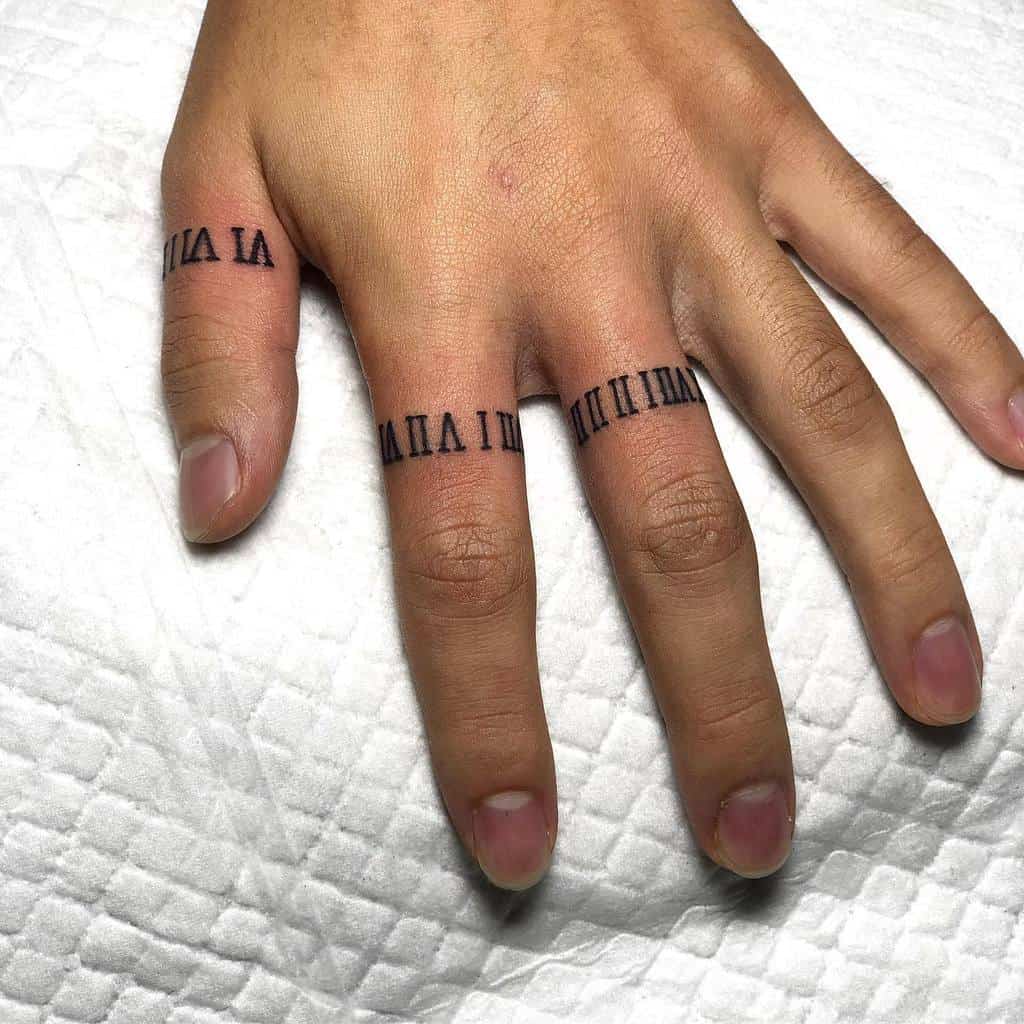 A set of black ink ring tattoos featuring Roman numerals, creating a minimalist and symbolic design