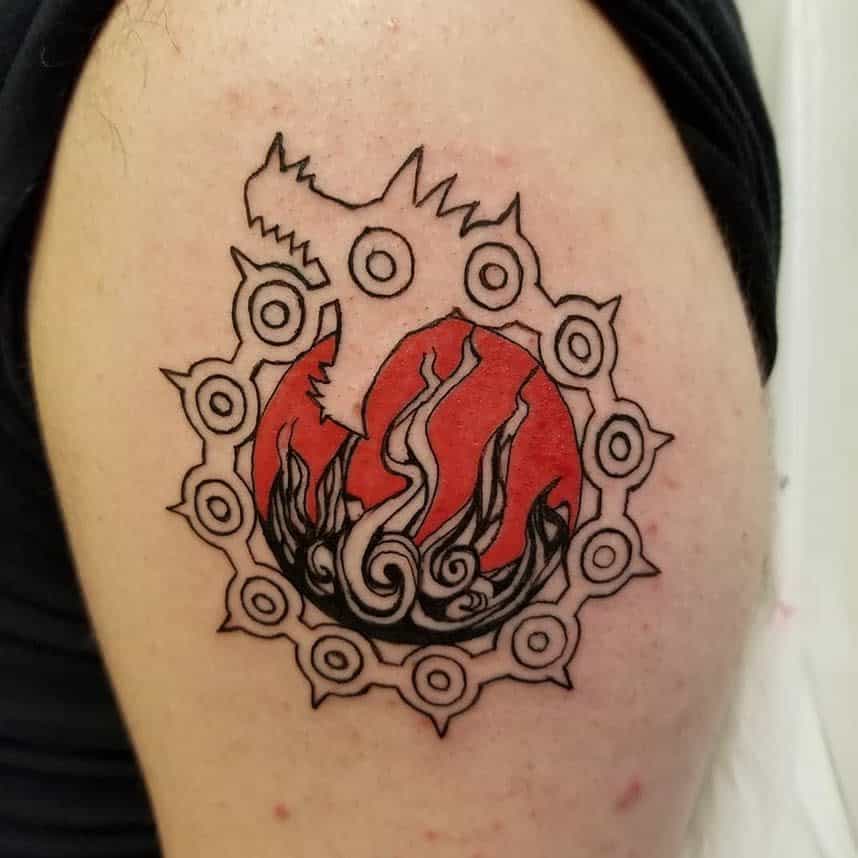 Tattoo of the Dragon's Sin of Wrath symbol from The Seven Deadly Sins, featuring a dragon's head, a circle of eyes, and fiery red and black swirls inside the circle